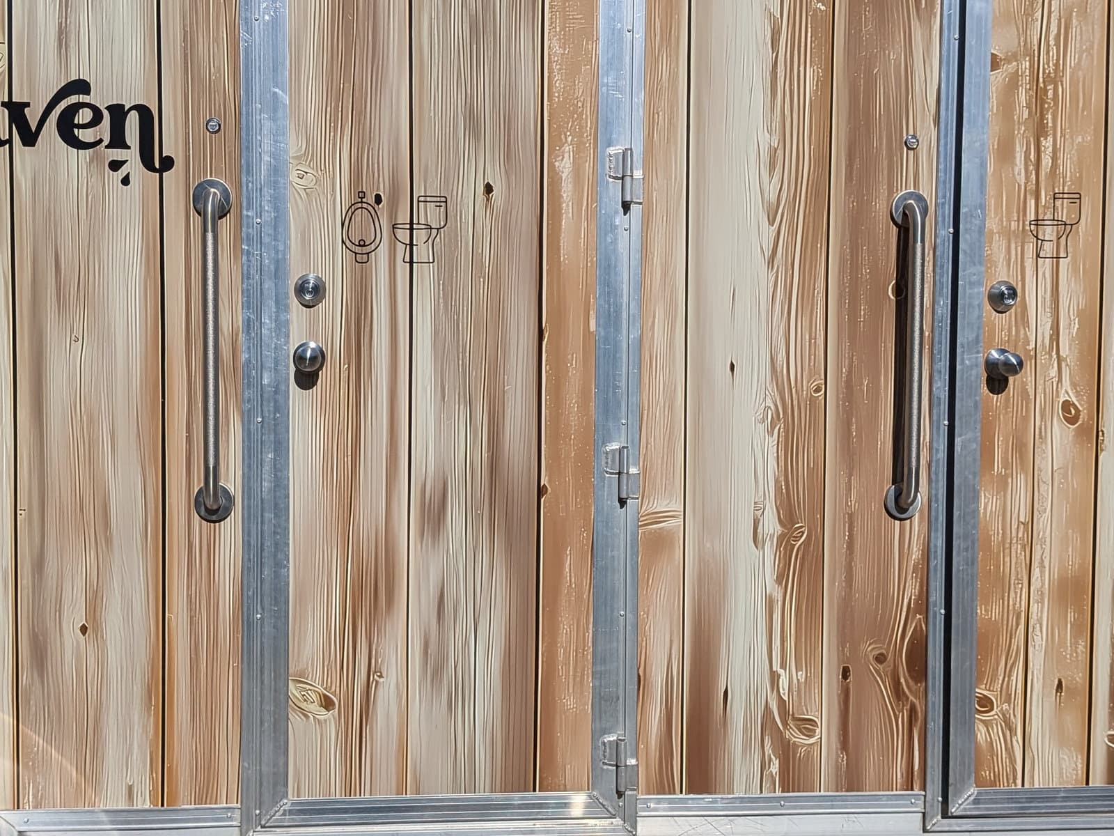 Close-up of the cedar door panels and hardware
