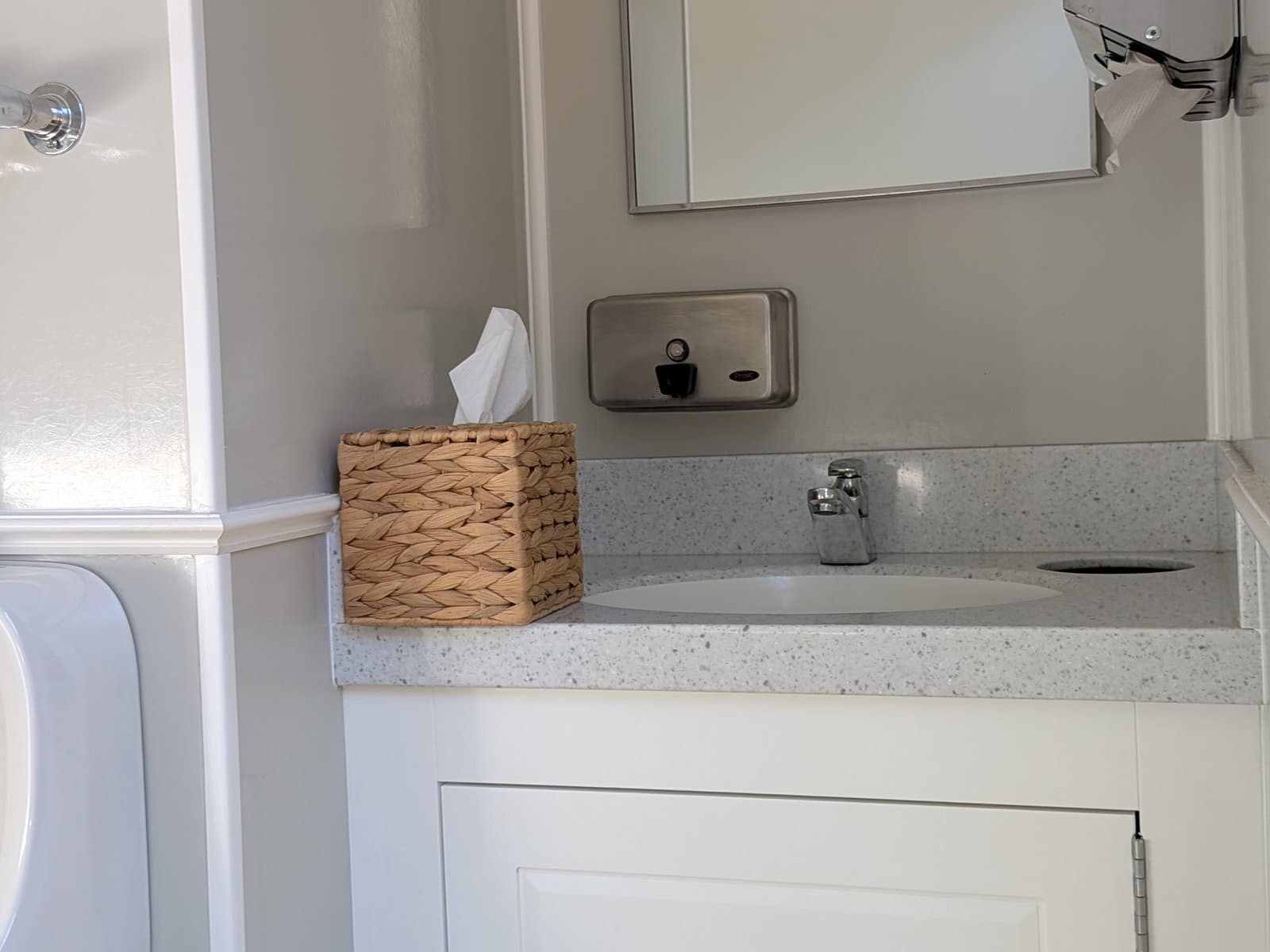 Interior stone countertop with full mirror and fresh tissues