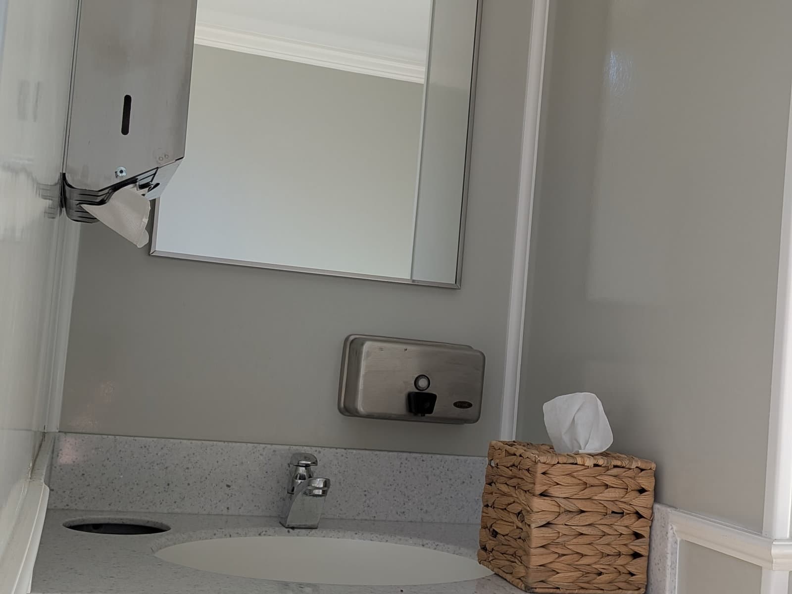 Full-size sink, mirror, and eco soap dispenser